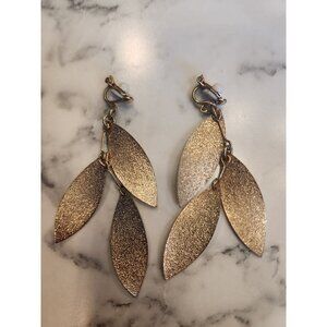Brushed Gold Tone Leaf Dangle Clip-On Earrings With Textured Finish